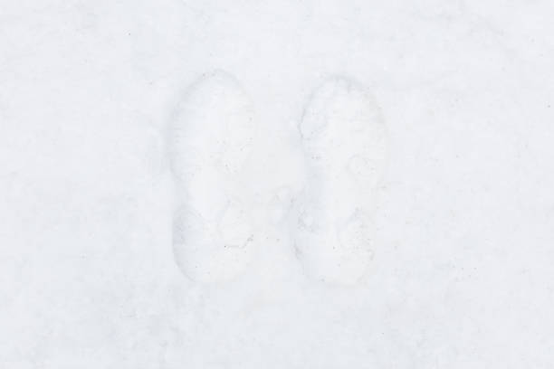 istock Footprints in the snow. winter landscape 1871331828