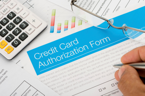 Credit card authorization form with paperwork