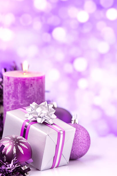 istock Purple Christmas scene with baubles, gift and candles 187135878
