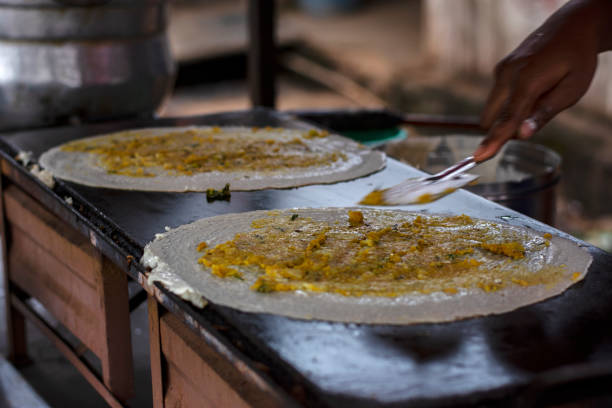istock Dosa making at the road side veg restaurant or stall. 1871362385