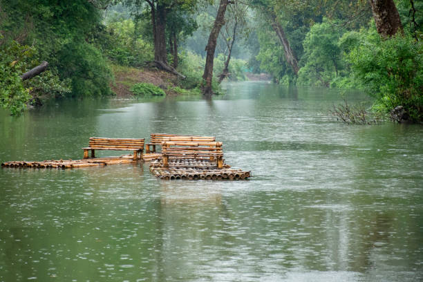 Two bamboo rafting boats floating river at Kanger valley national park.