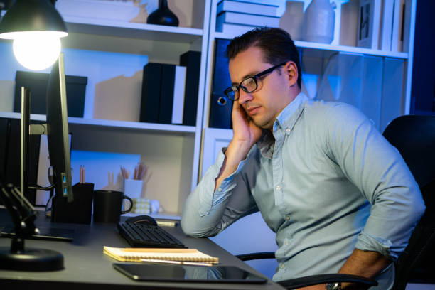 istock Working businessman sleepy feeling with project at night time. Sellable. 1871377137