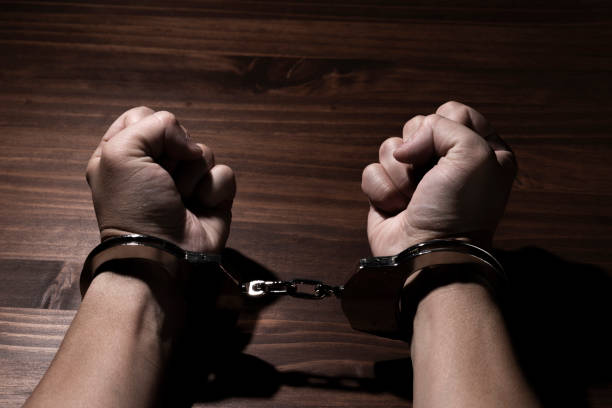 istock Handcuffed Male Hands in Restraint 1871383023