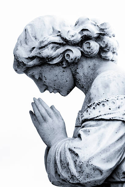 istock Praying girl, white marble statue against white bacground 187138986