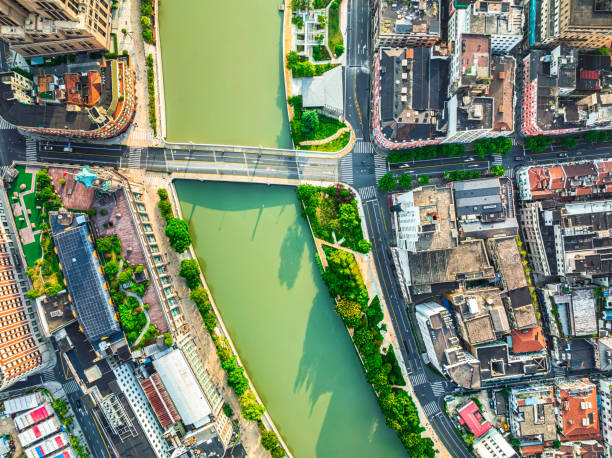 Free Stock Photo of Aerial view of a bustling city with river and ...