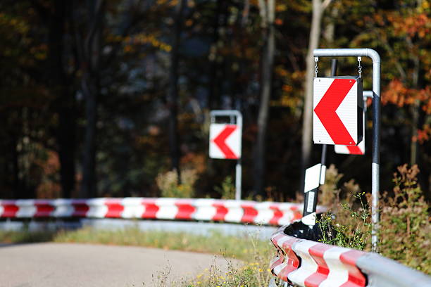 Road sign direction dangerous turn.
