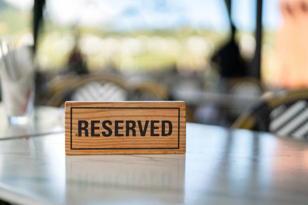 istock Wooden reservation sign on the dining table. 1871411667
