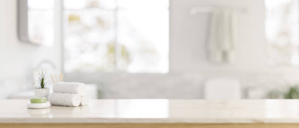 istock A white tabletop with a copy space and a blurred background of a modern bright bathroom. 1871413704
