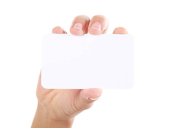istock Hand holding business card on white background 187142298