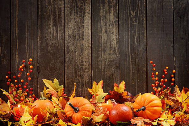 istock Autumn decoration with maple leaves and pumpkins on old woods 187142362