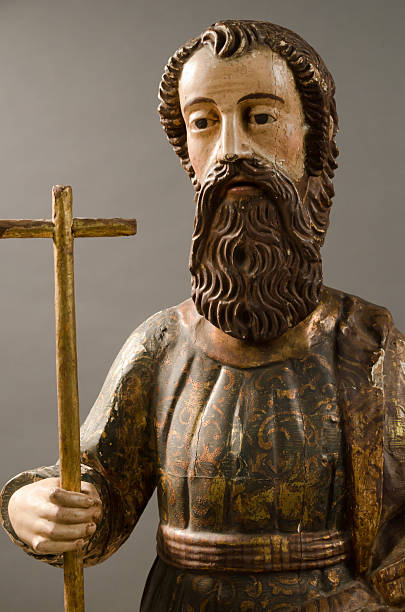 istock 19th Century Carved Saint Holding a Cross 187142392