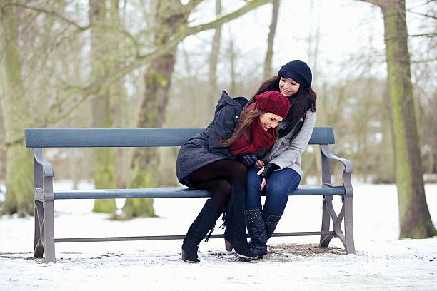 istock Two Friends at the Park Sharing a Good Laugh 187145643