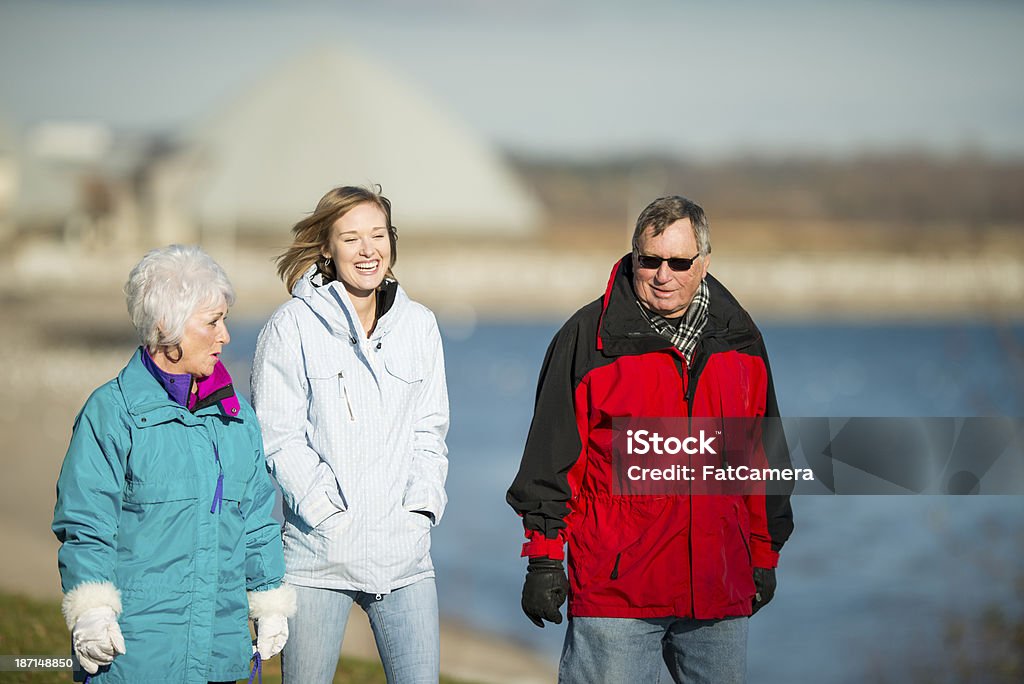 Grandparents and Adult Grandchild. Grandparents and adult grandchild out in the park 20-29 Years Stock Photo