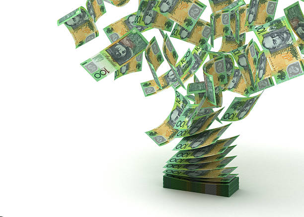 Flying Australian Dollar Flying Australian Dollar (isolated with clipping path) australian dollar stock pictures, royalty-free photos & images