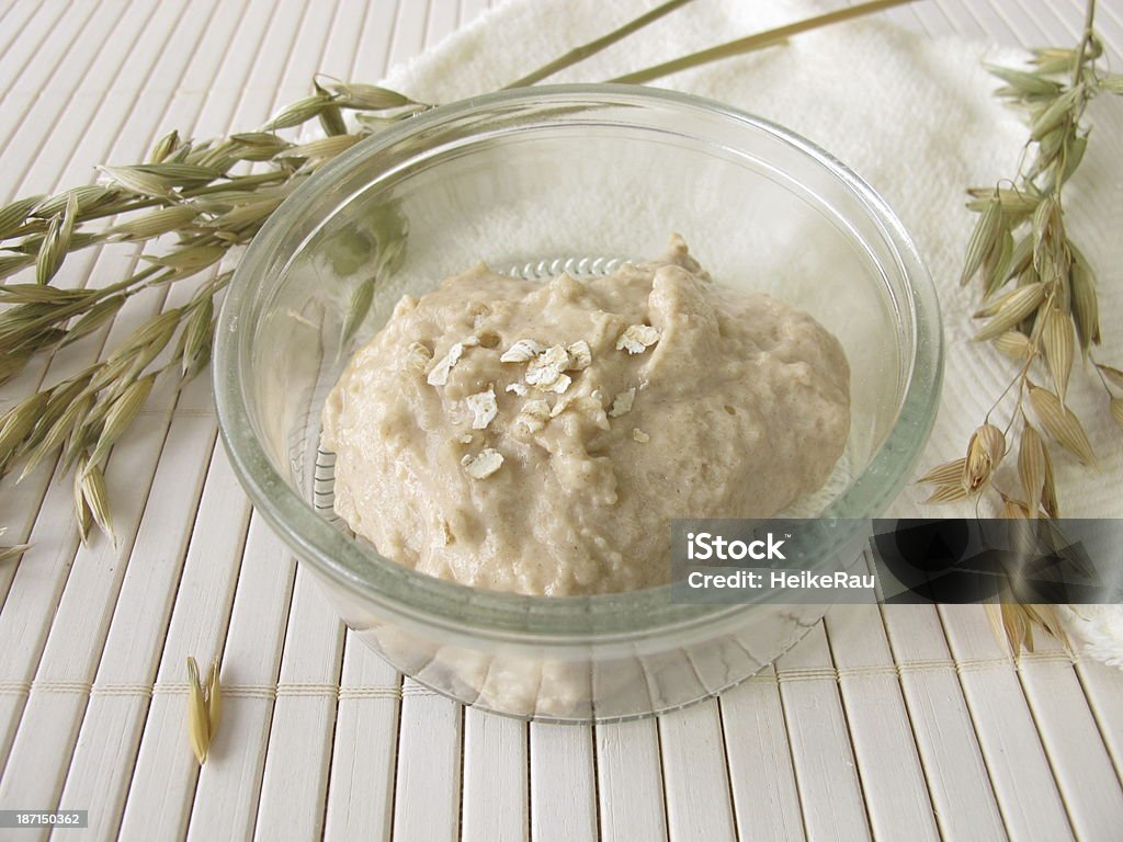 Facial mask with oats in a bowl Facial mask with oats - Skin soothing face mask with oats Facial Mask - Beauty Product Stock Photo