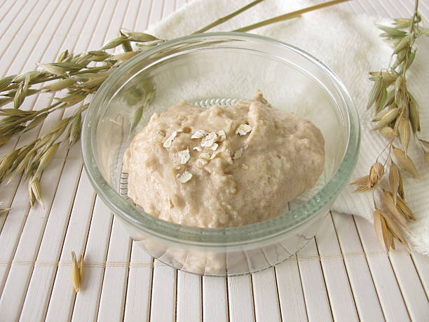 Facial mask with oats in a bowl stock photo