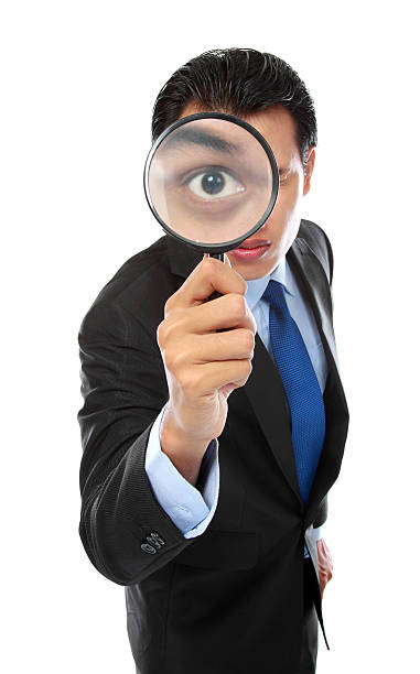 istock businessman with magnifying glass 187150395