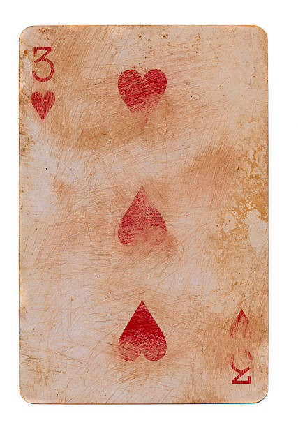 istock old  playing card with three red hearts isolated on white 187150676