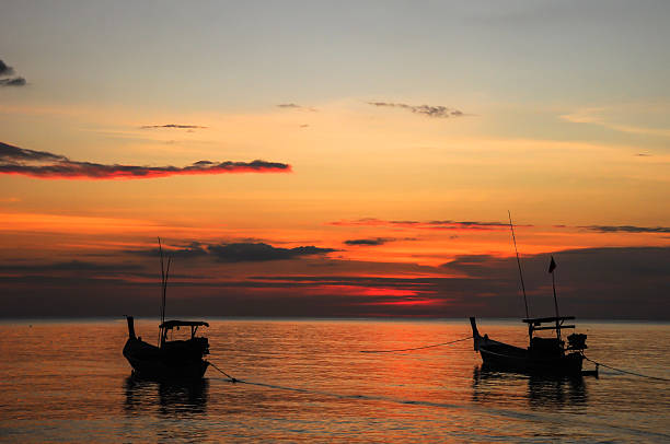 istock Fishing Boat at beach and sunset 187150703