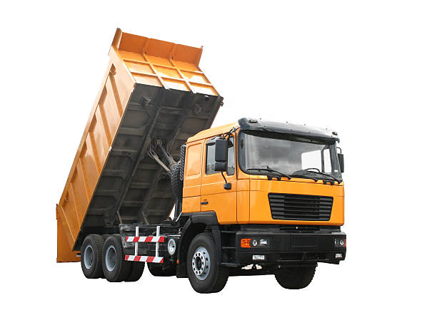 Yellow dump truck Yellow dump truck isolated over white background dump truck photos stock pictures, royalty-free photos & images