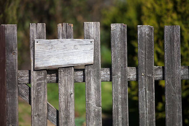 istock Wooden fence with empty sign board 187151233