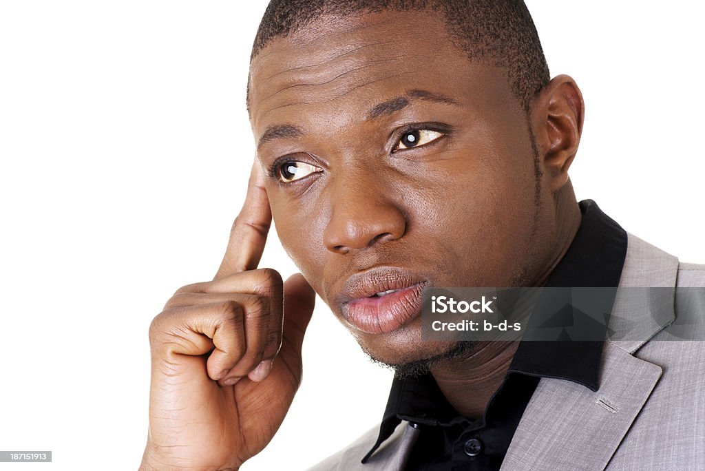 Atractivo joven hombre de negocios pensando. En primer plano. - Foto de stock de Casualidad libre de derechos