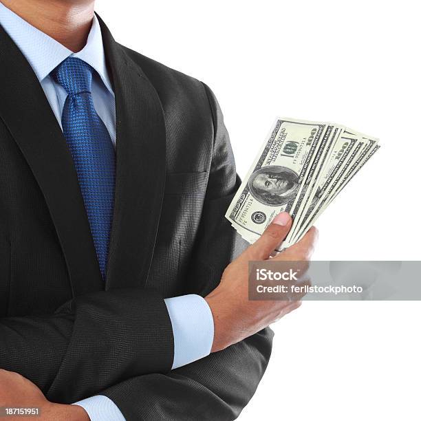 Hombre De Negocios Con Dinero De La Mano Foto de stock y más banco de imágenes de Actividad comercial - Actividad comercial, Actividades bancarias, Adulto