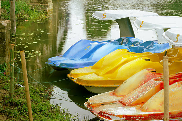 istock old Pedal boats in lake 187152003