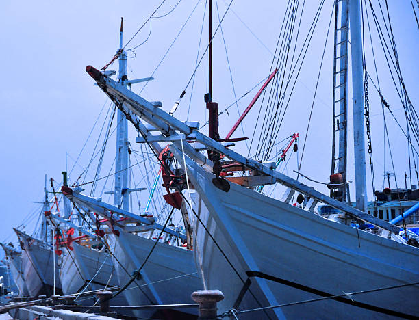 Jakarta, Java, Indonesia: prows of pinisi ships at Sunda Kelapa harbor - once the main port of Sunda Kingdom of Pajajaran and a Portuguese outpost -  photo by M.Torres