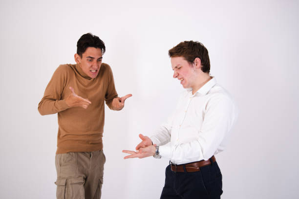istock A beautiful couple is sorting things out. Two guys rejoice and quarrel. 1871531559