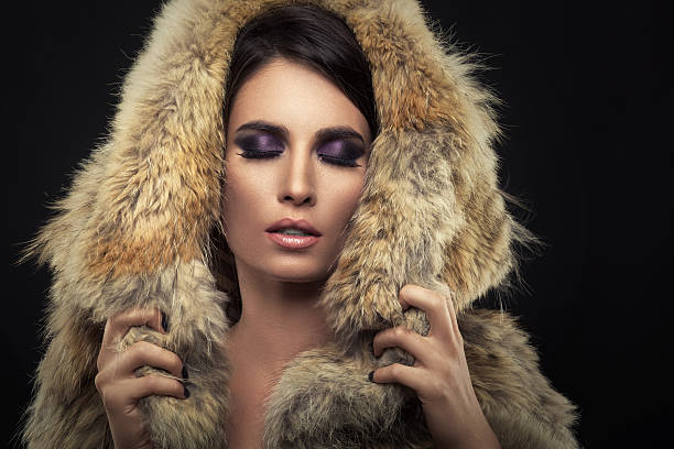 istock Beautiful woman posing in a fur coat 187153863