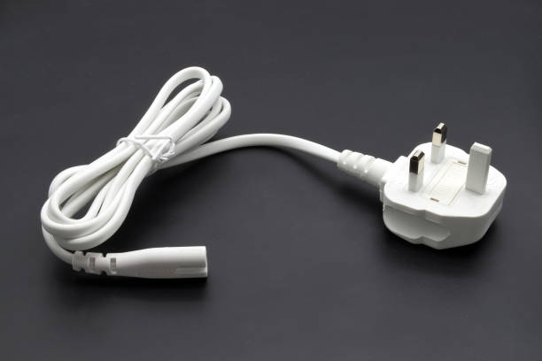 istock UK type power cable isolated on black background 1871543038
