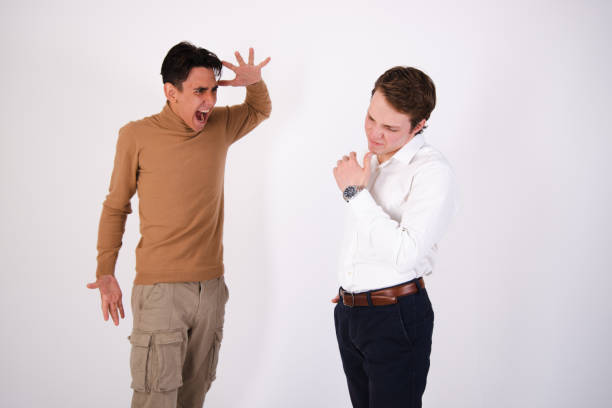 istock A beautiful couple is sorting things out. Two guys rejoice and quarrel. 1871544085