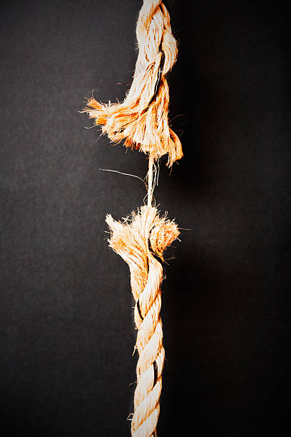 istock At breaking point, rope is frayed to last strand 187154539