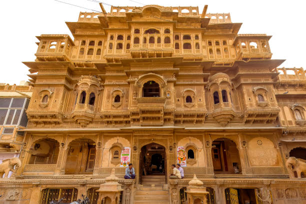 Nathmal Ji Ki Haveli Jaisalmer, Rajasthan, India November 12, 2017: A few local are seen sitting in front of Nathmal Ji Ki Haveli Havelis of Jaisalmer stock pictures, royalty-free photos & images