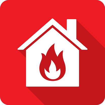 Vector illustration of a house with flame icon against a red background in flat style.