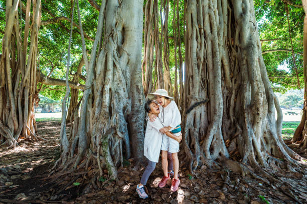 istock Affectionate senior adult best friends embracing while on a hike 1871557734