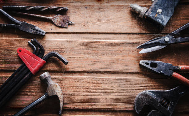 istock grungy old tools on a wooden background 1871566156
