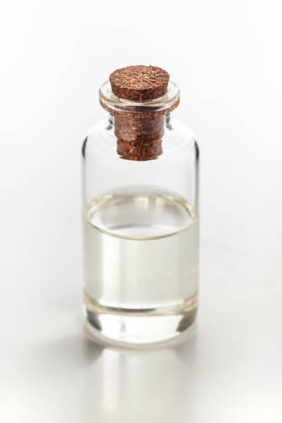 istock A round glass bottle containing clear transparent essential oil. 1871569814