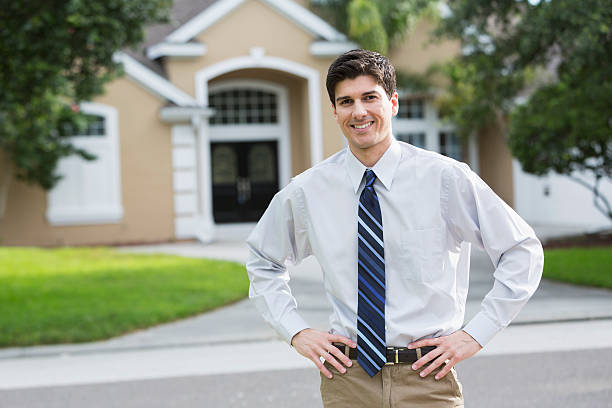 istock Man standing in front of house 187158333