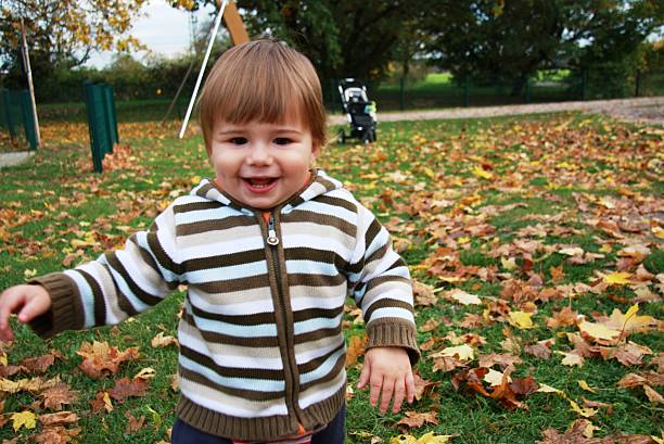 little boy on the playground stock photo
