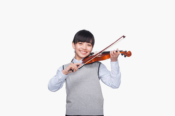istock Girl playing the violin 187158868