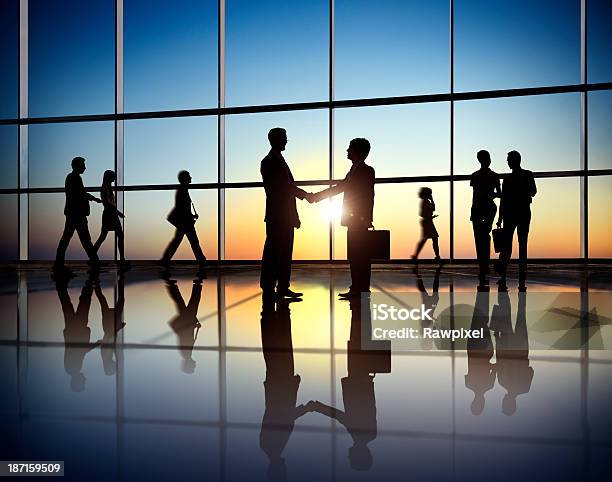 Silhouette People In Office Building Shaking Hands Stock Photo - Download Image Now - In Silhouette, Sunset, Business Person