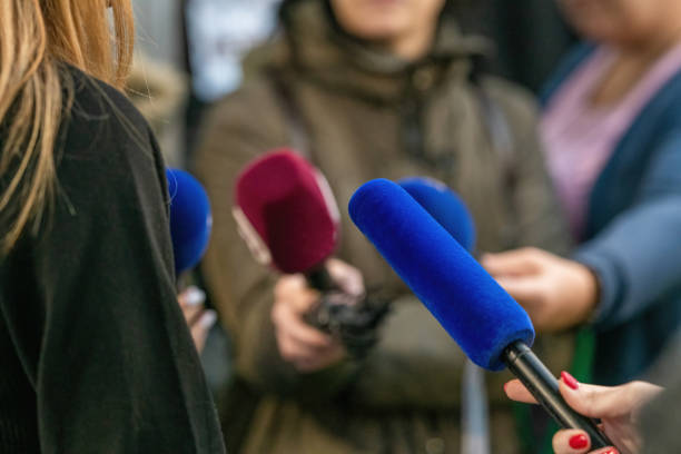 istock Journalists descends upon an event interview,with collective focus on interviewed person 1871601395
