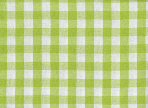 green and white chequered fabric texture useful as a background