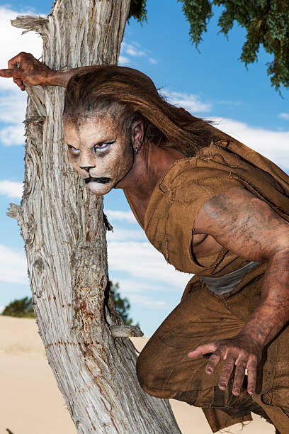 istock Humanoid Lion in a tree ready to pounce 187161205