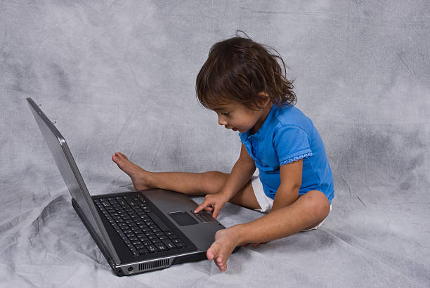 istock Little girl on the computer 187161744