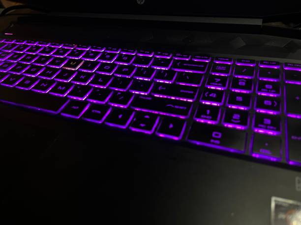 istock Purple light laptop keyboard 1871618134