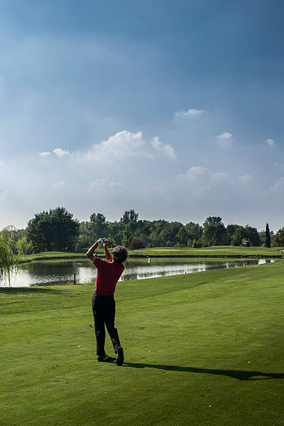 istock golfer hits ball to the putting green 187162204