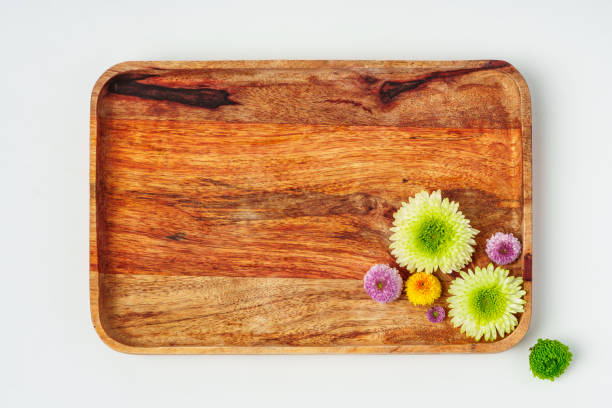 istock Wooden tray with flowers isolated on white background 1871622845